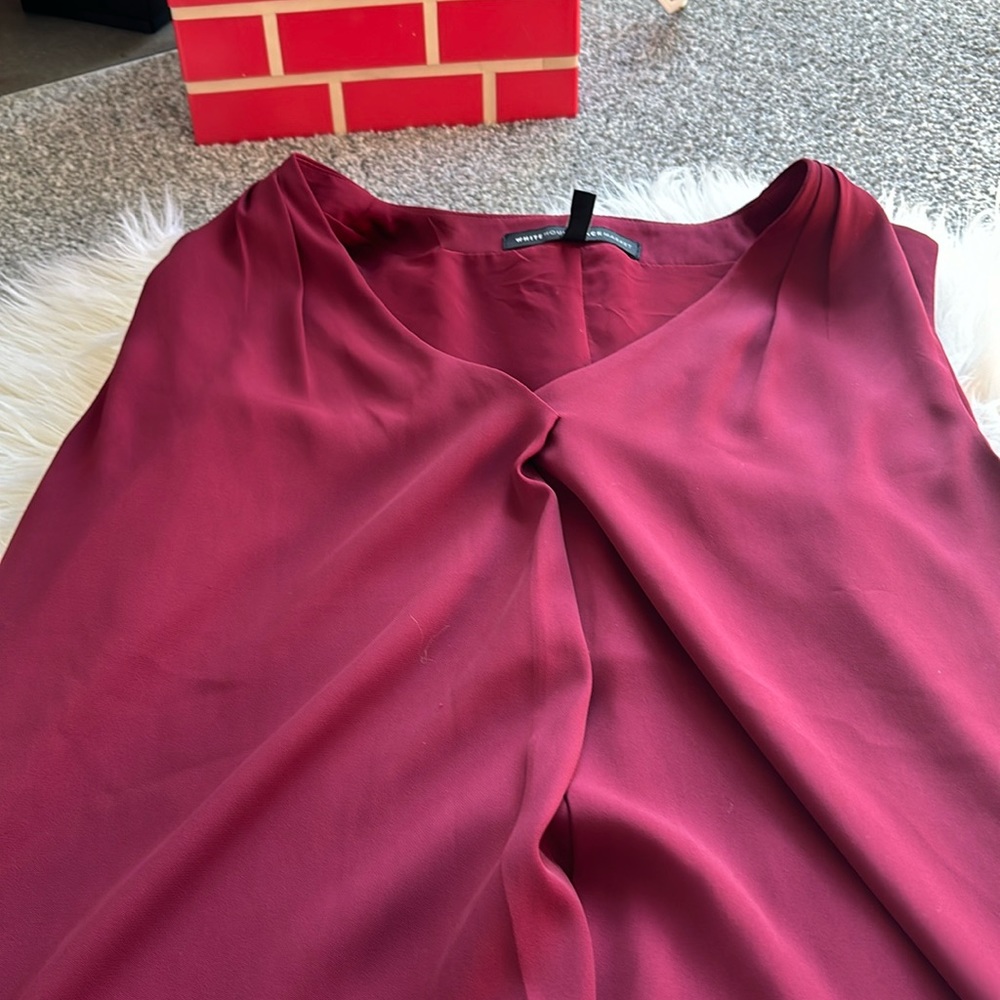 Sleeveless top in excellent condition.Would look great for holidays.